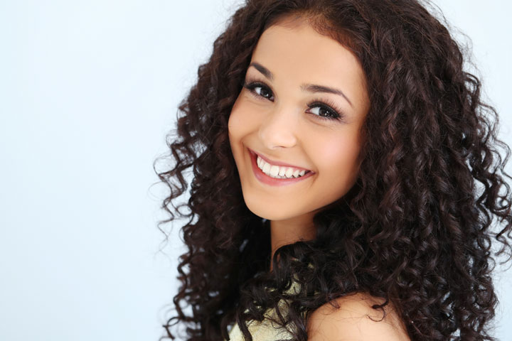latin charming beautiful young woman with black curly hair